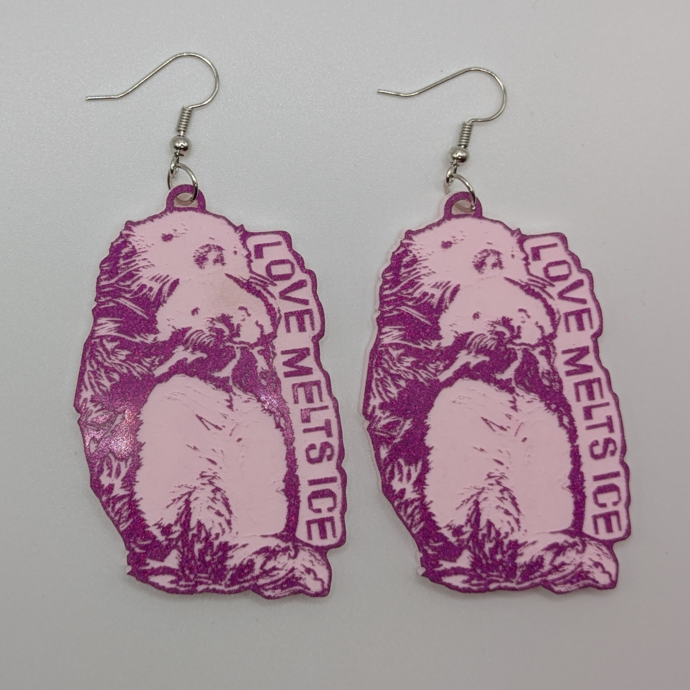 Big Purple Studio's Love Melts Ice Otter Earrings & Pins - Smitten Kitten Variant