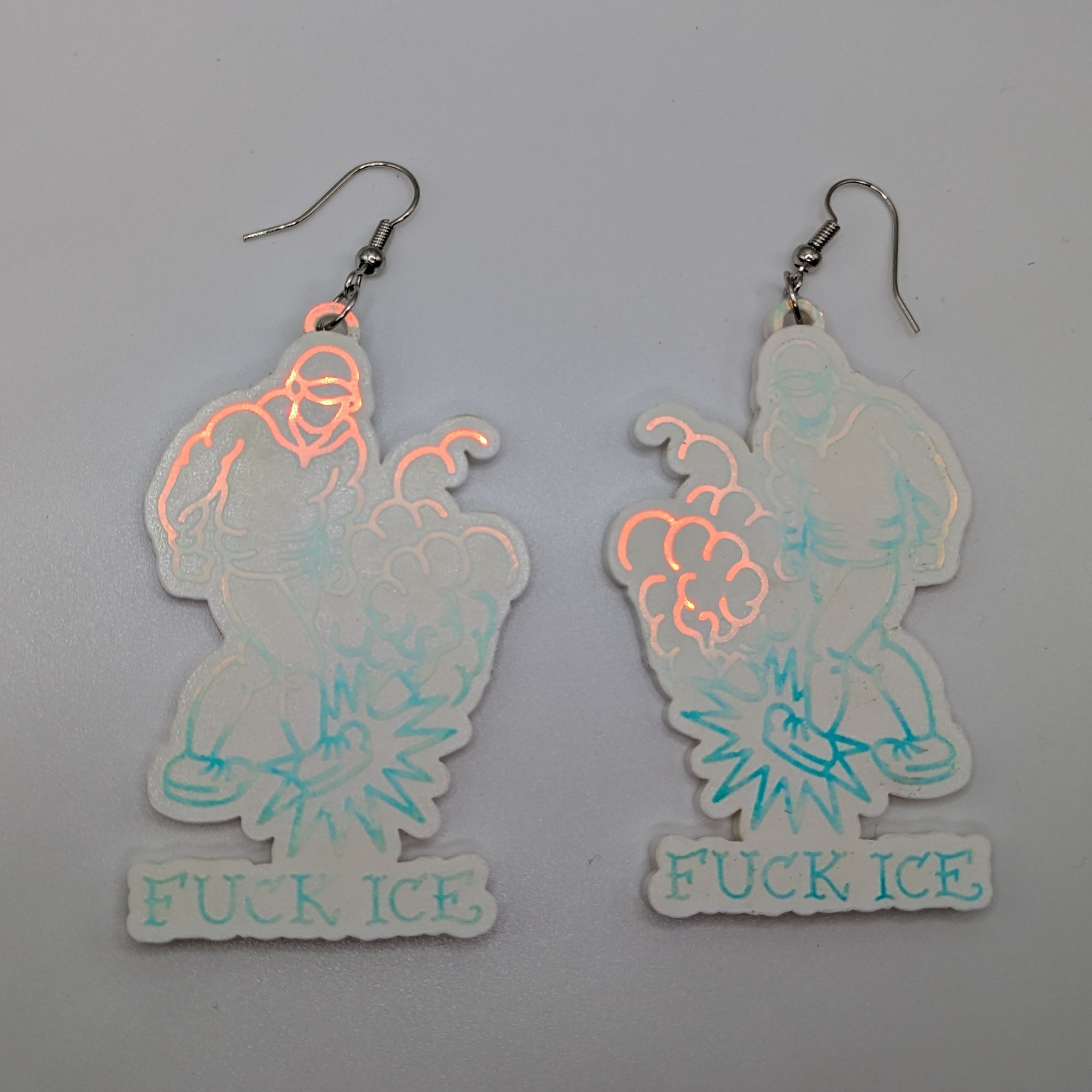 Andrea Bartsch's Prism Fuck ICE Creative Resistance Earrings and Pins